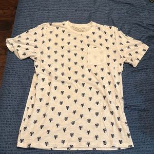 White and navy shirts with a front pocket